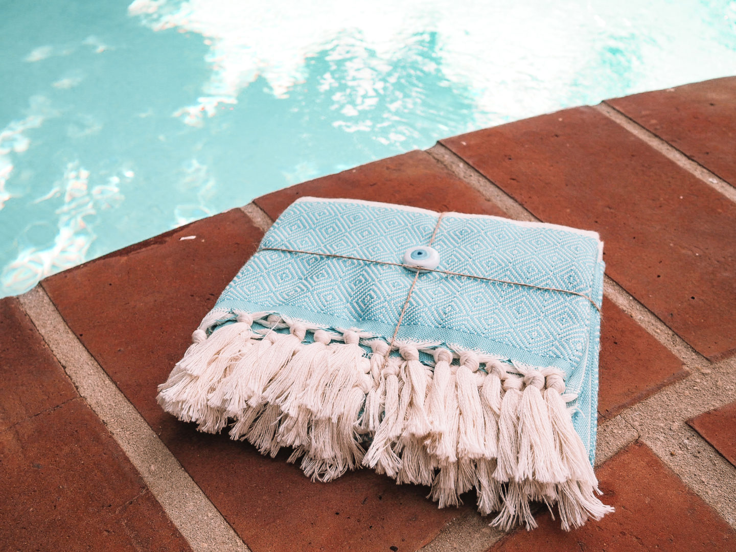 beach towel by a pool - a great gift for beach lovers