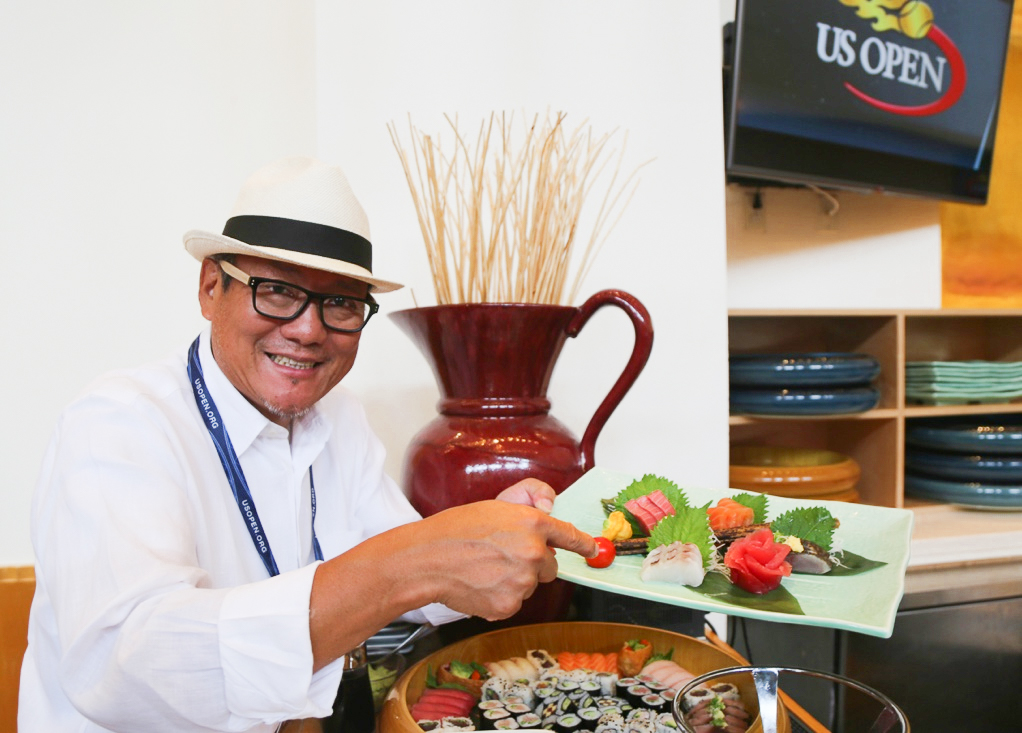 Masaharu Morimoto displaying a selection of sushi