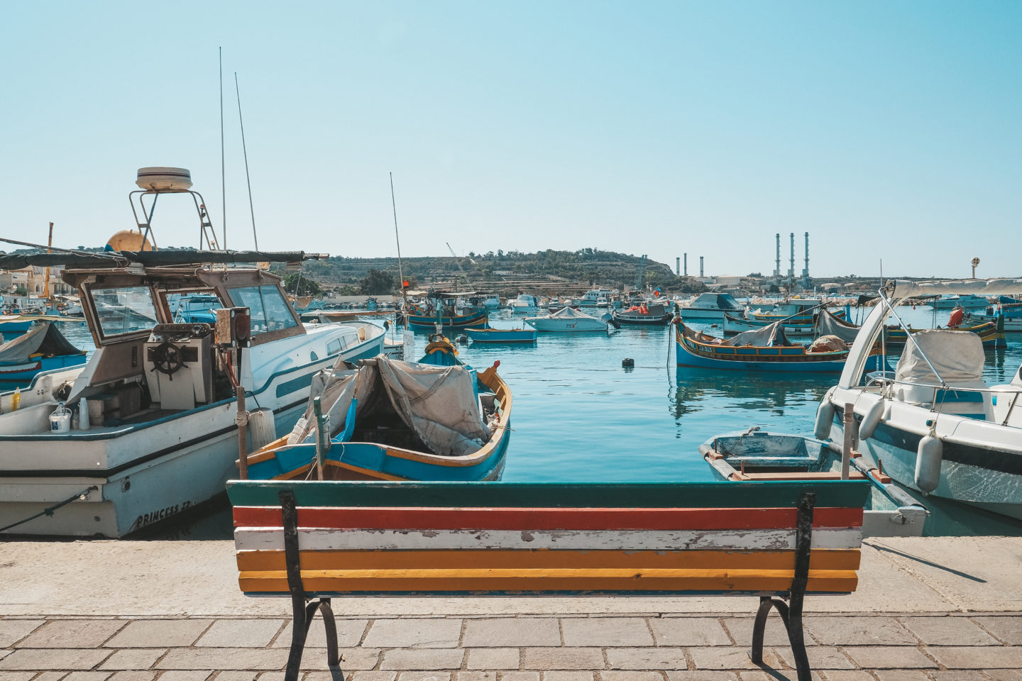 A bench overlooking the water in Marsaxlokk fishing village