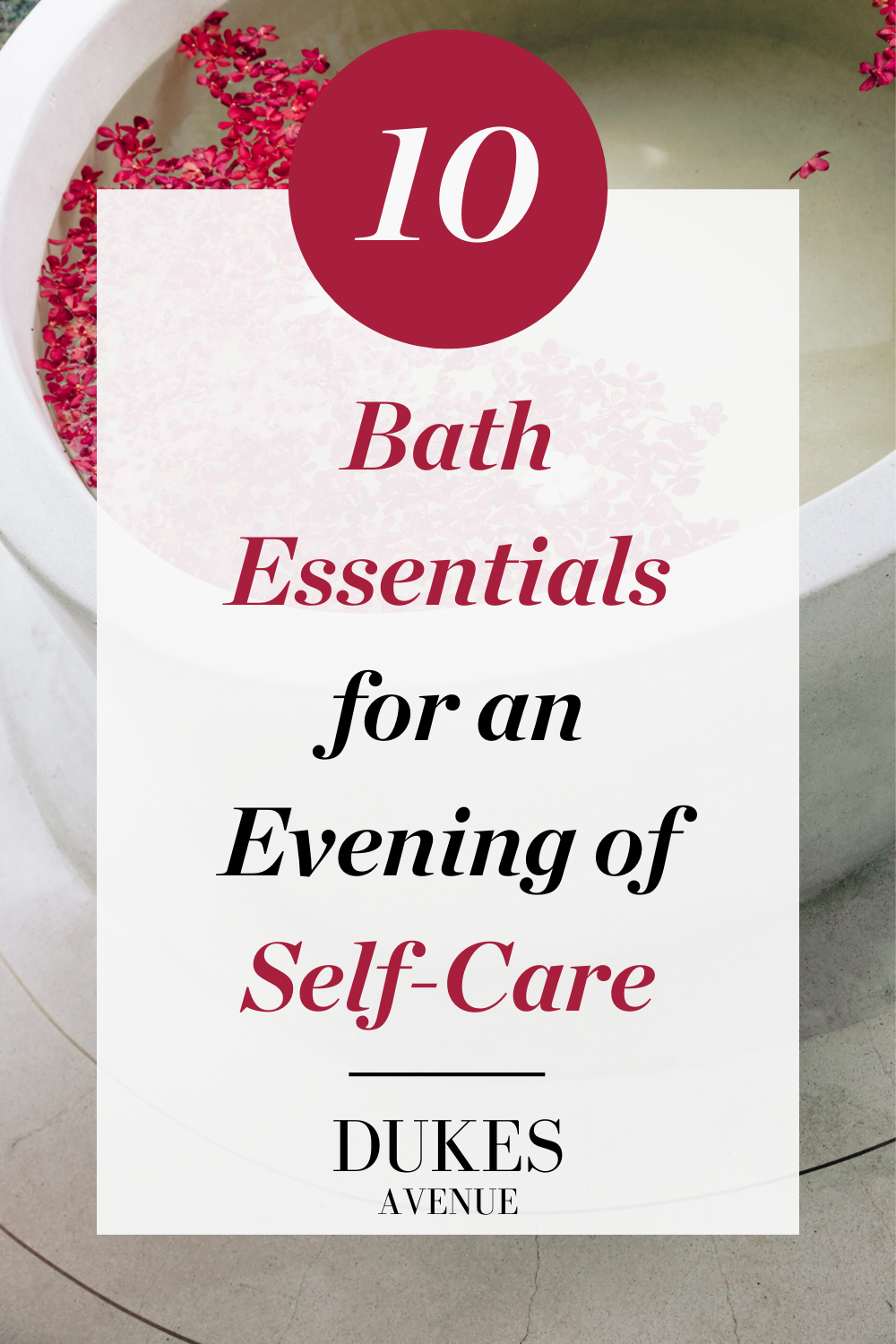 Bath with pink petals with text overlay of '10 Bath Essentials for an Evening of Self-Care'