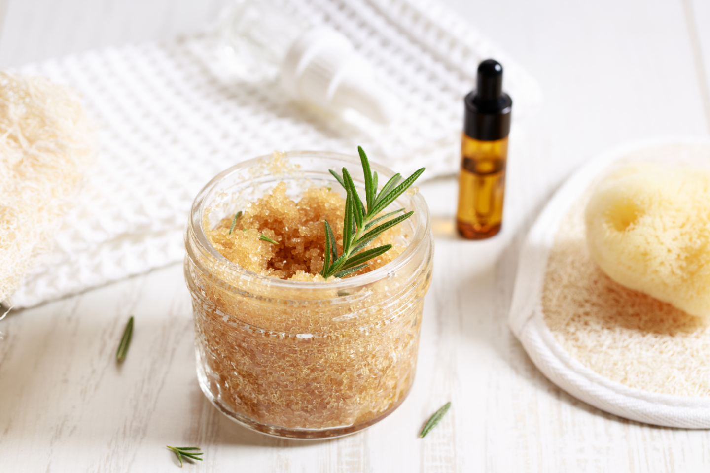 Pot of sugar body scrub on a white background