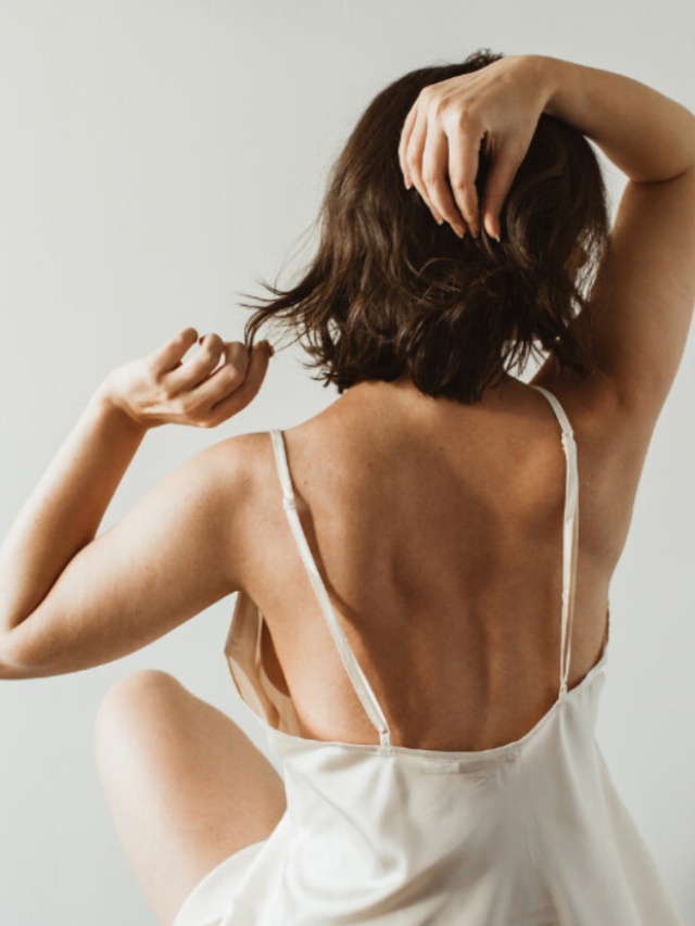 A woman from the back touching her brown hair as shown on the Dukes Avenue homepage