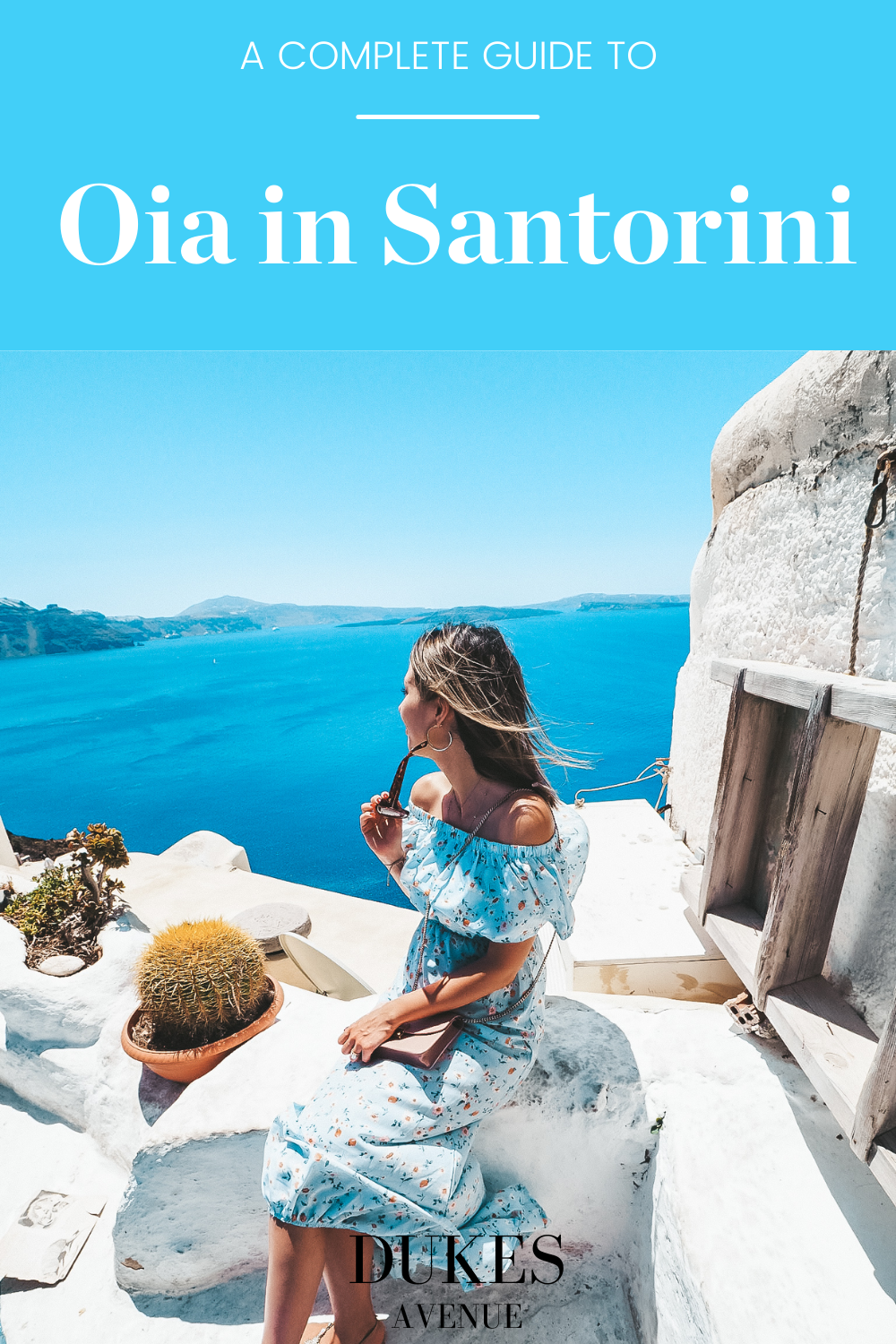 A woman admiring the sea with text overlay "A Complete Guide to Oia in Santorini"