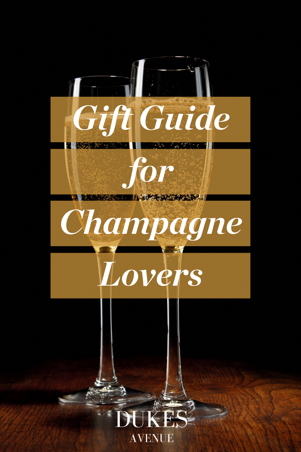 Two champagne glasses on a wooden surface with text overlay "Gift Guide for Champagne Lovers"