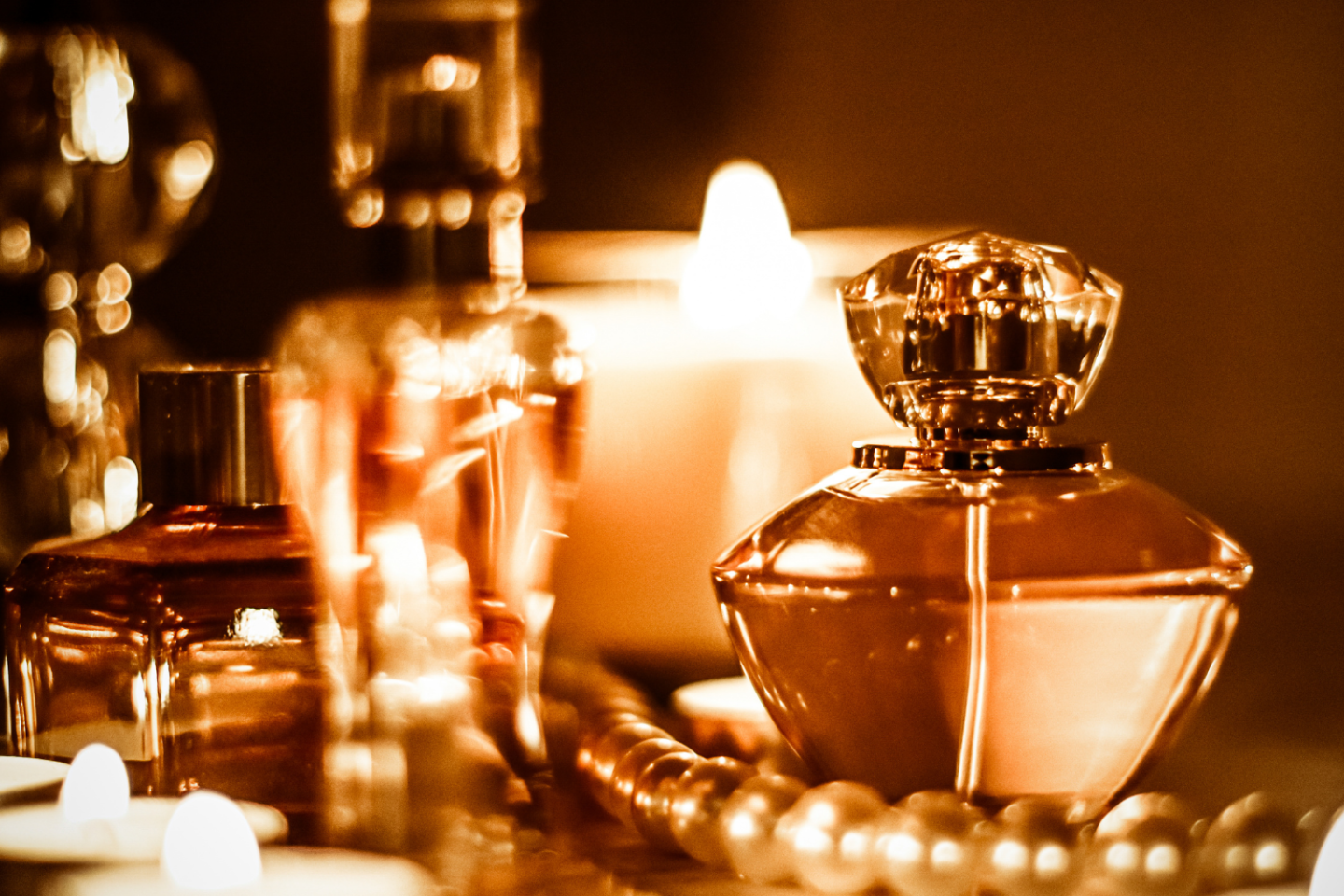 Eau de parfums and eau de toilettes against a dark background