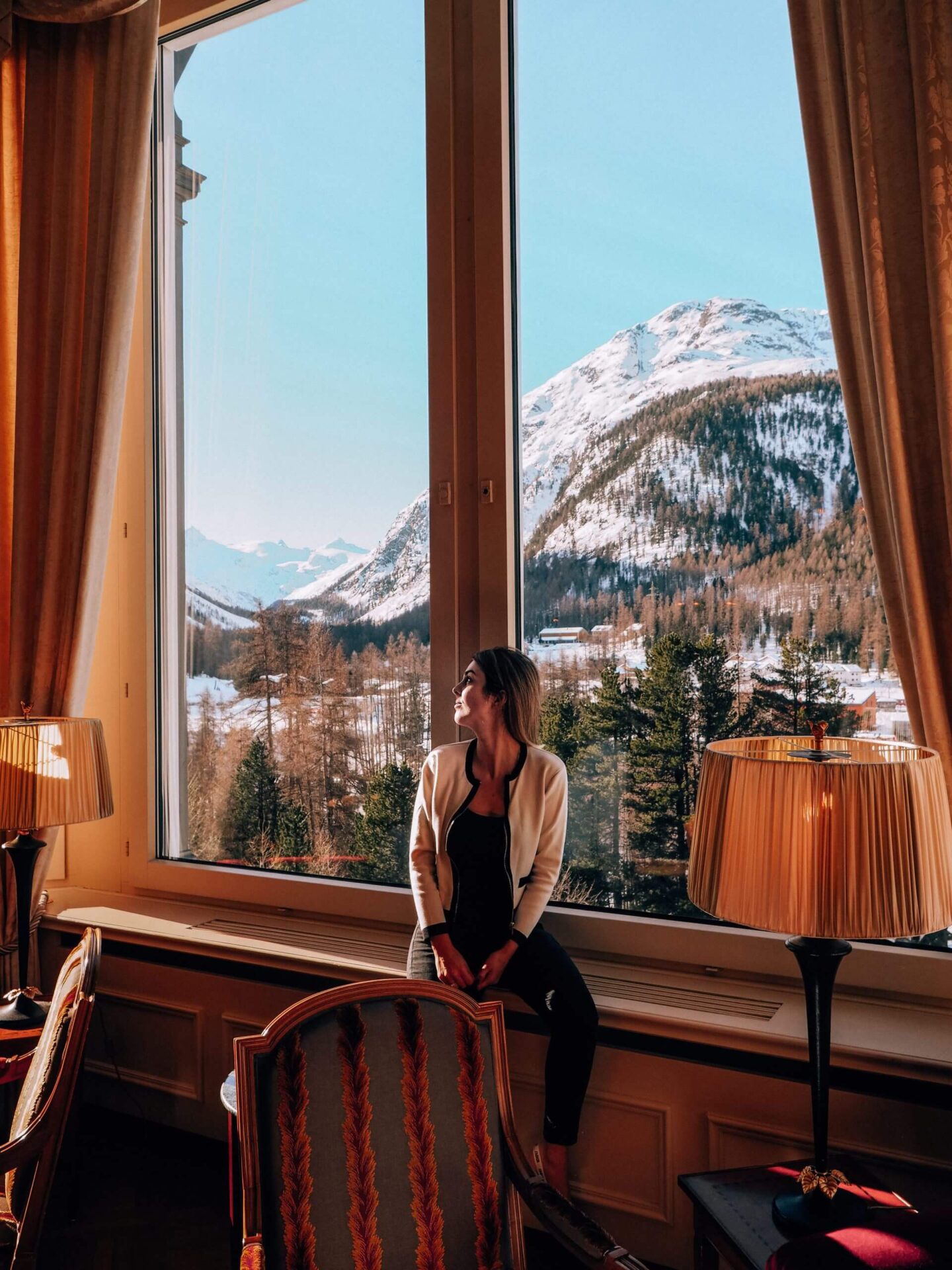 Woman sitting in the Grand Hotel Kronenhof, a luxury Pontresina hotel
