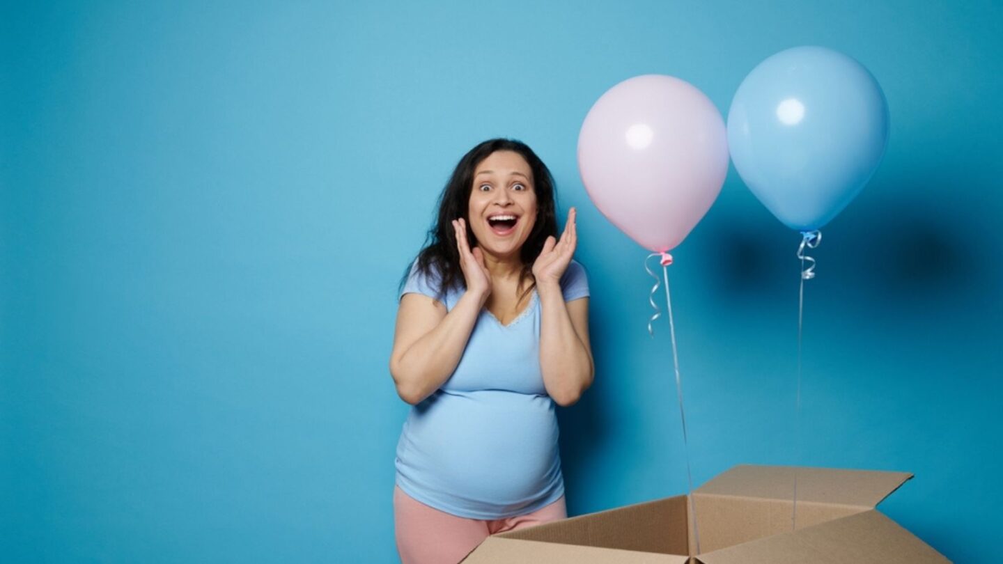Woman celebrating gender reveal of her baby