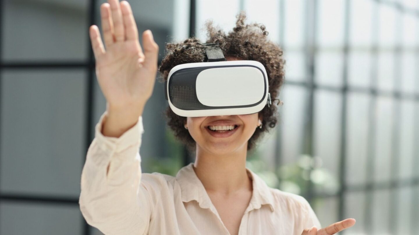 a girl in a modern office uses 3D glasses to study a new project